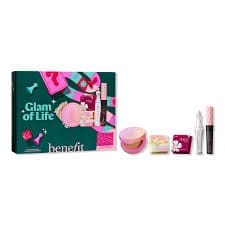 Benefit Cosmetics ‘Glam of Life’ 6-piece makeup gift set featuring a mix of mini makeup products displayed beside the illustrated green and pink gift box
