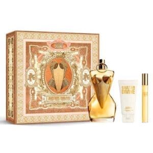 Jean Paul Gaultier Divine gift set featuring a gold torso-shaped perfume bottle, matching body lotion, travel spray, and an ornate decorative box in gold and peach tones