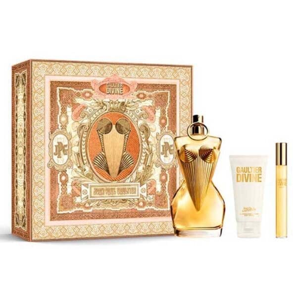 Jean Paul Gaultier Divine gift set featuring a gold torso-shaped perfume bottle, matching body lotion, travel spray, and an ornate decorative box in gold and peach tones