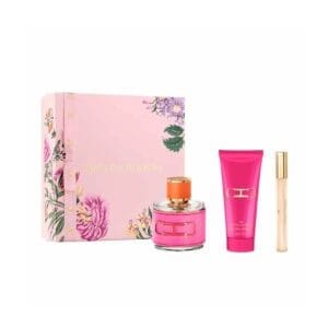 Carolina Herrera CH Woman gift set featuring a pink floral decorative box, a round pink-accented perfume bottle, a matching bright pink body lotion, and a slim travel spray with a gold cap