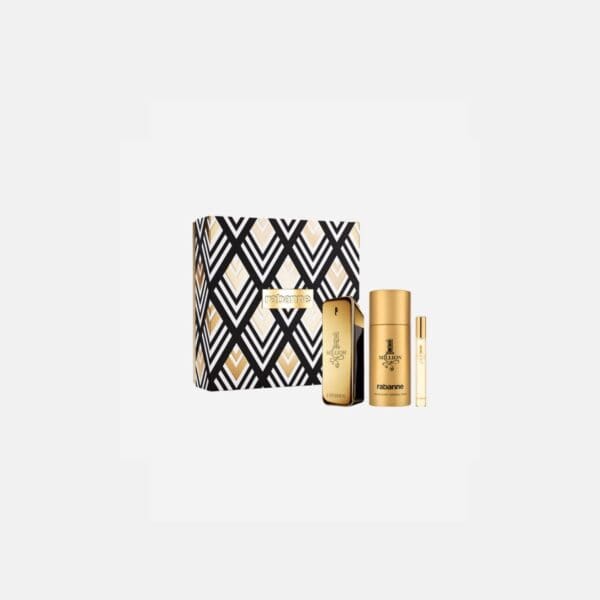 Close-up of the Rabanne 1 Million Gold gift set displaying a gold deodorant spray, gold perfume bottle, and travel-size fragrance spray inside a black, white, and gold geometric-patterned presentation box.